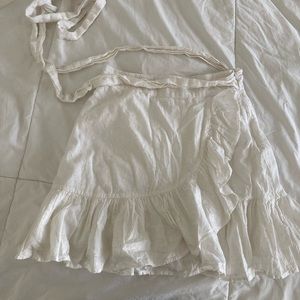 White eyelet ruffle tie skirt by Tularosa